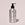 Acure body lotion bottle on a light background